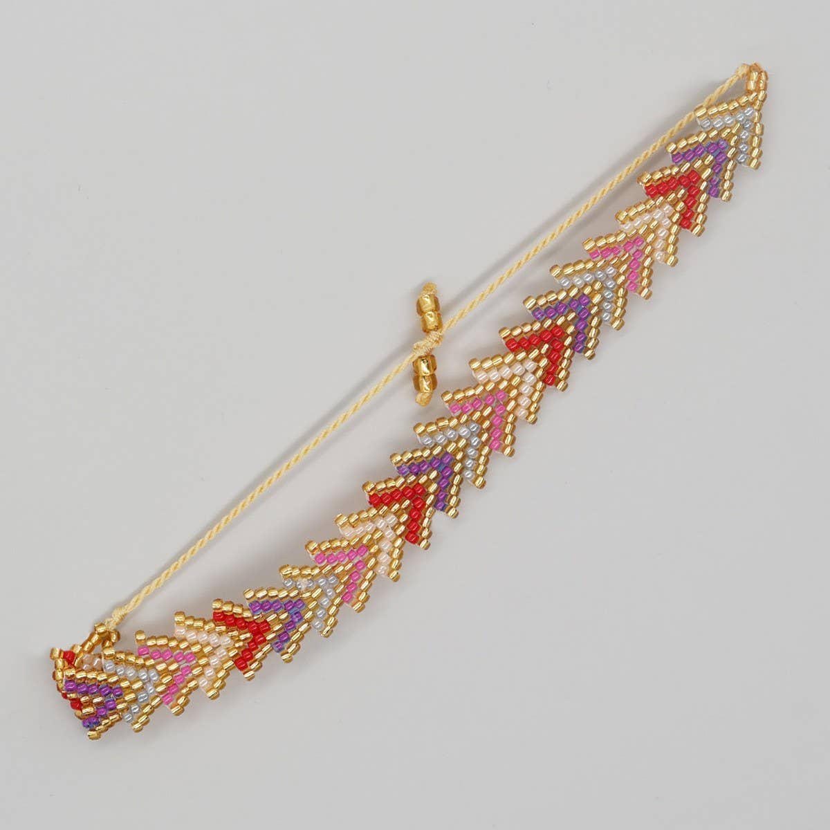 RICE BEAD HAND-WOVEN RAINBOW FLOWER BRACELET