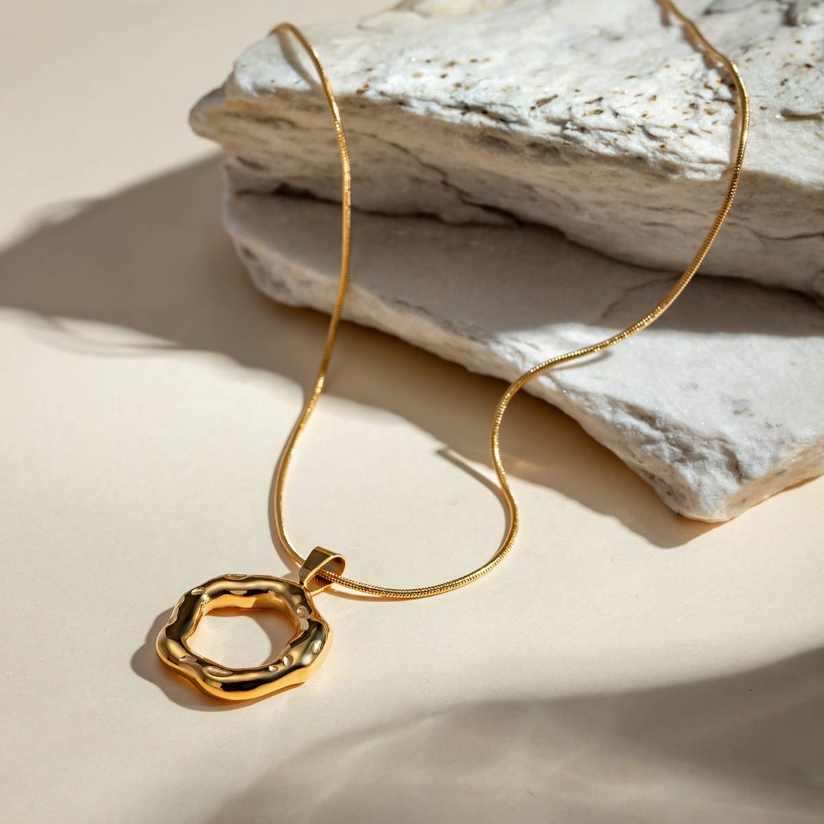 IRREGULAR HAMMERED ROUND SNAKE BONE NECKLACE