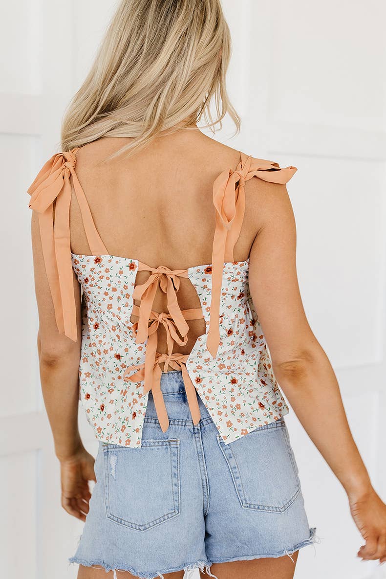 Floral suspenders hollowed out behind the pleats