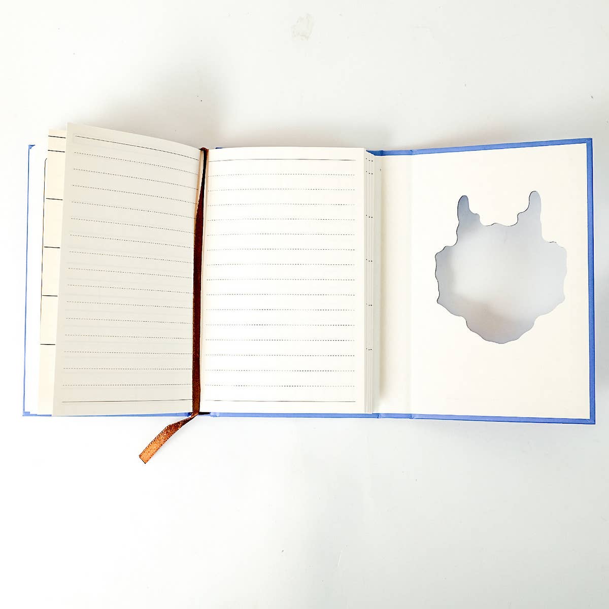 COLORFUL PORTABLE NOTEBOOK ON BLUE BACKGROUND