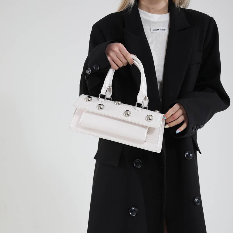 Fashionable rivet personalized hand-held tote bag
