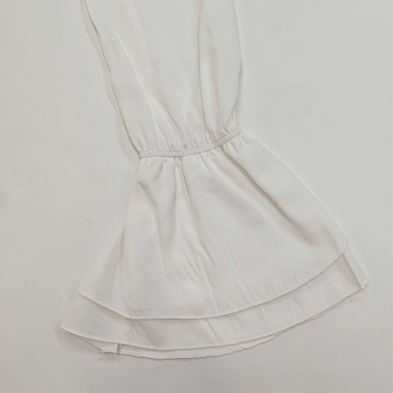 A stylish lace-up design with ruffled cardigan