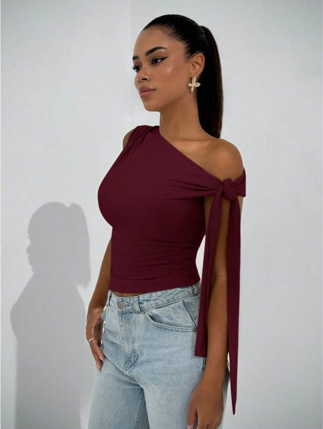 Body-hugging, ribbon-tied, diagonal tie,top