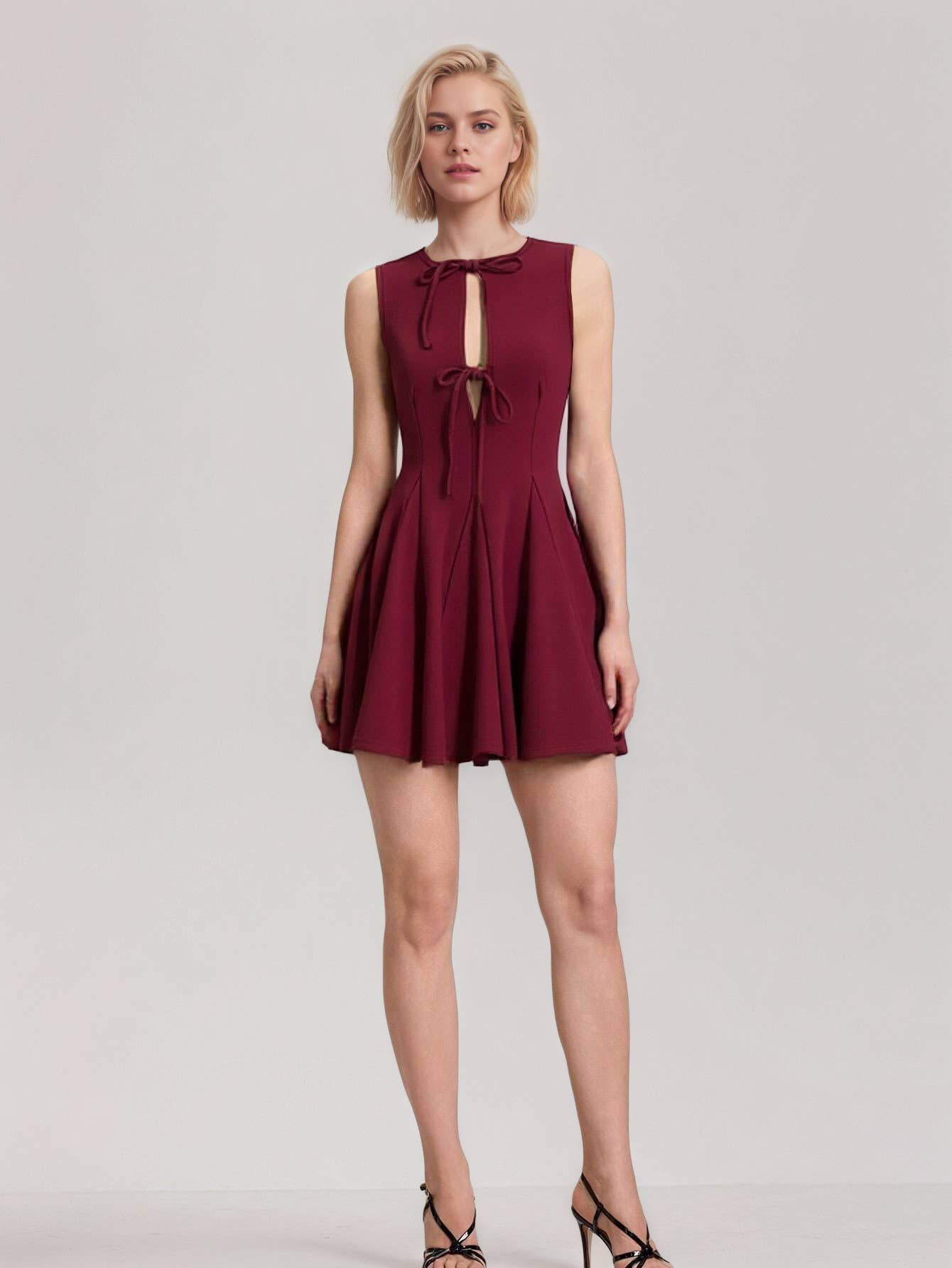 Fitted waist and bow tie sleeveless dress