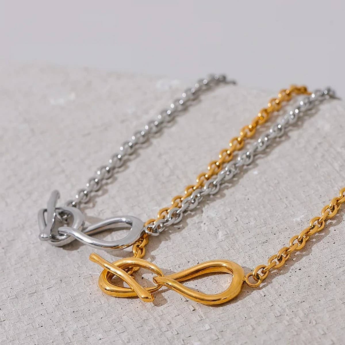 Titanium steel necklace with bow pendant