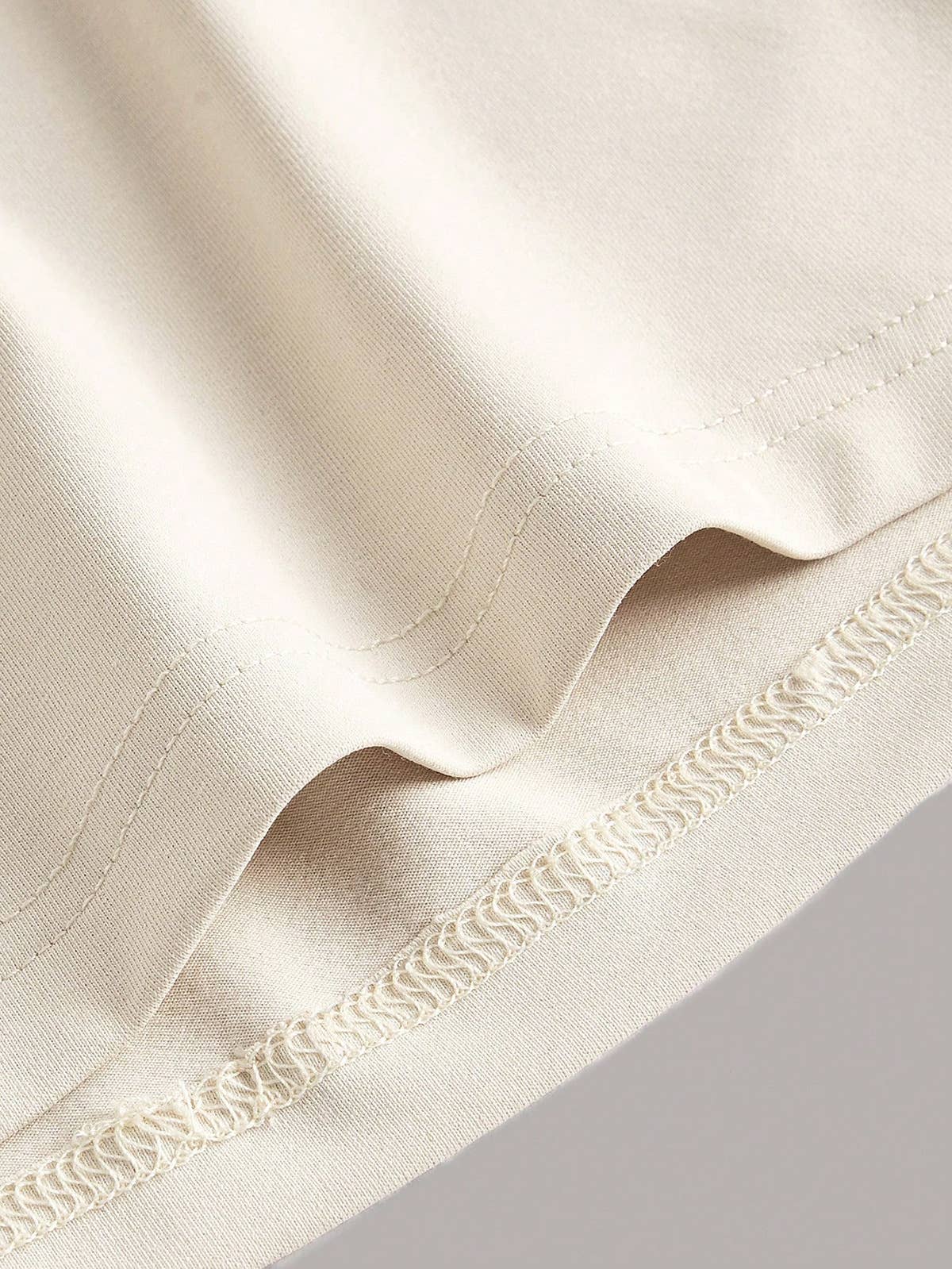 Cinched waist sleeveless and form-fitting dress