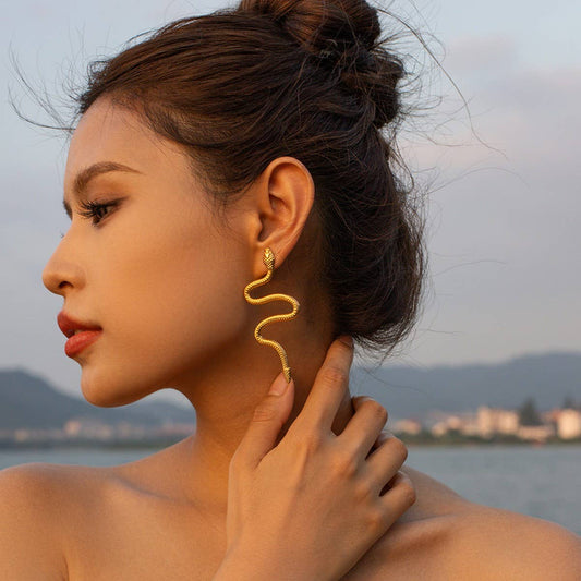 GOLD CURVED SNAKE DESIGN TITANIUM EARRINGS
