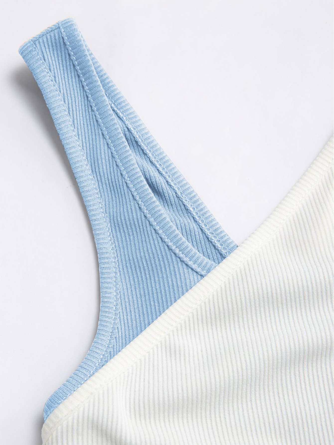 Contrasting colors and stripes form-fitting vest