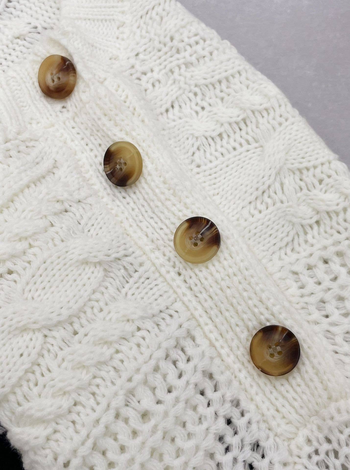 Buttons embellished with striped twist sweaters