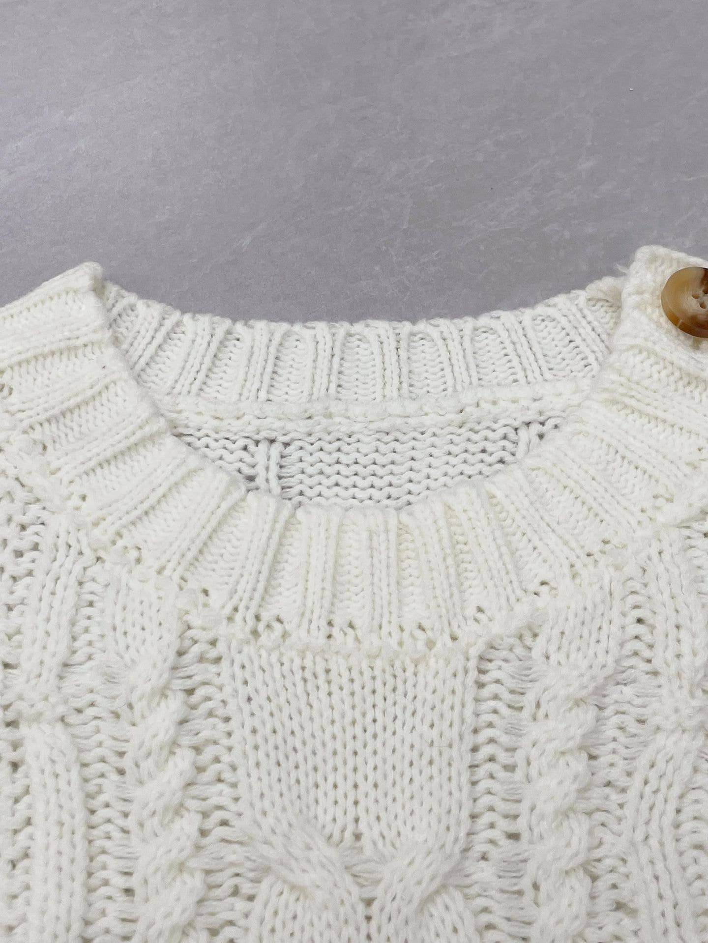 Buttons embellished with striped twist sweaters