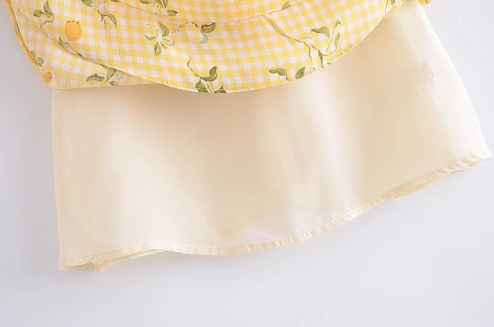 A strappy dress with floral prints and ruffles