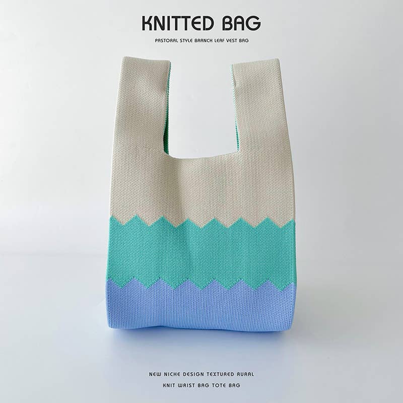 Heart-shaped color-blocked knitted handbag