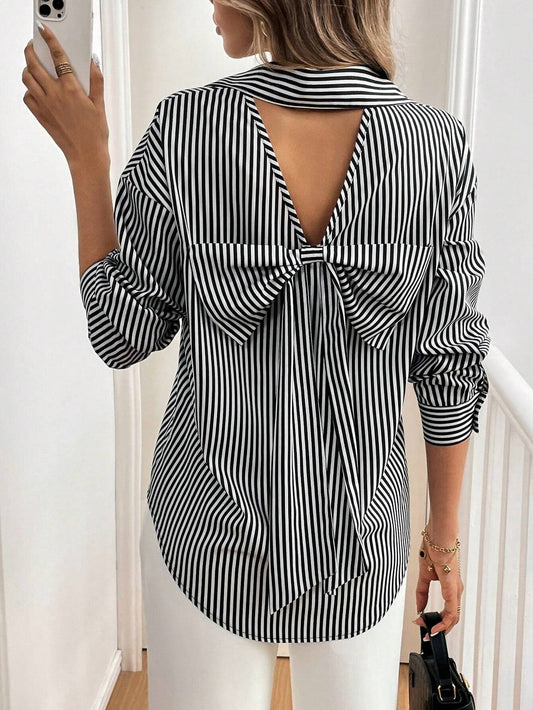 A striped printed long-sleeved shirt with a bow