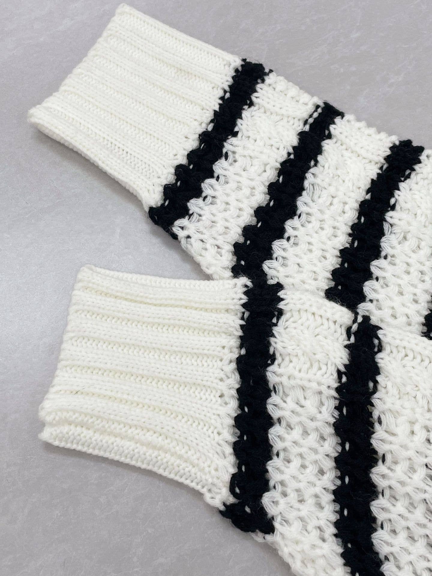 Buttons embellished with striped twist sweaters