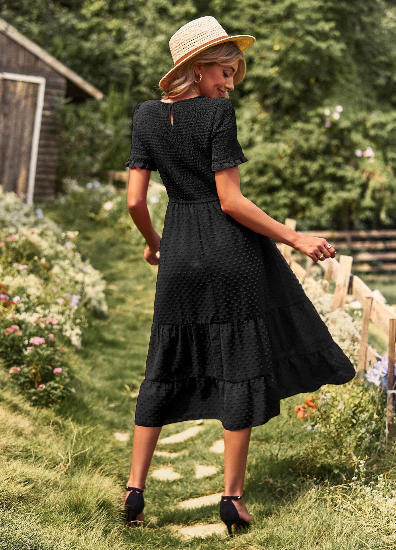 FLAUNTING A FLOWING SLIM-FIT DRESS