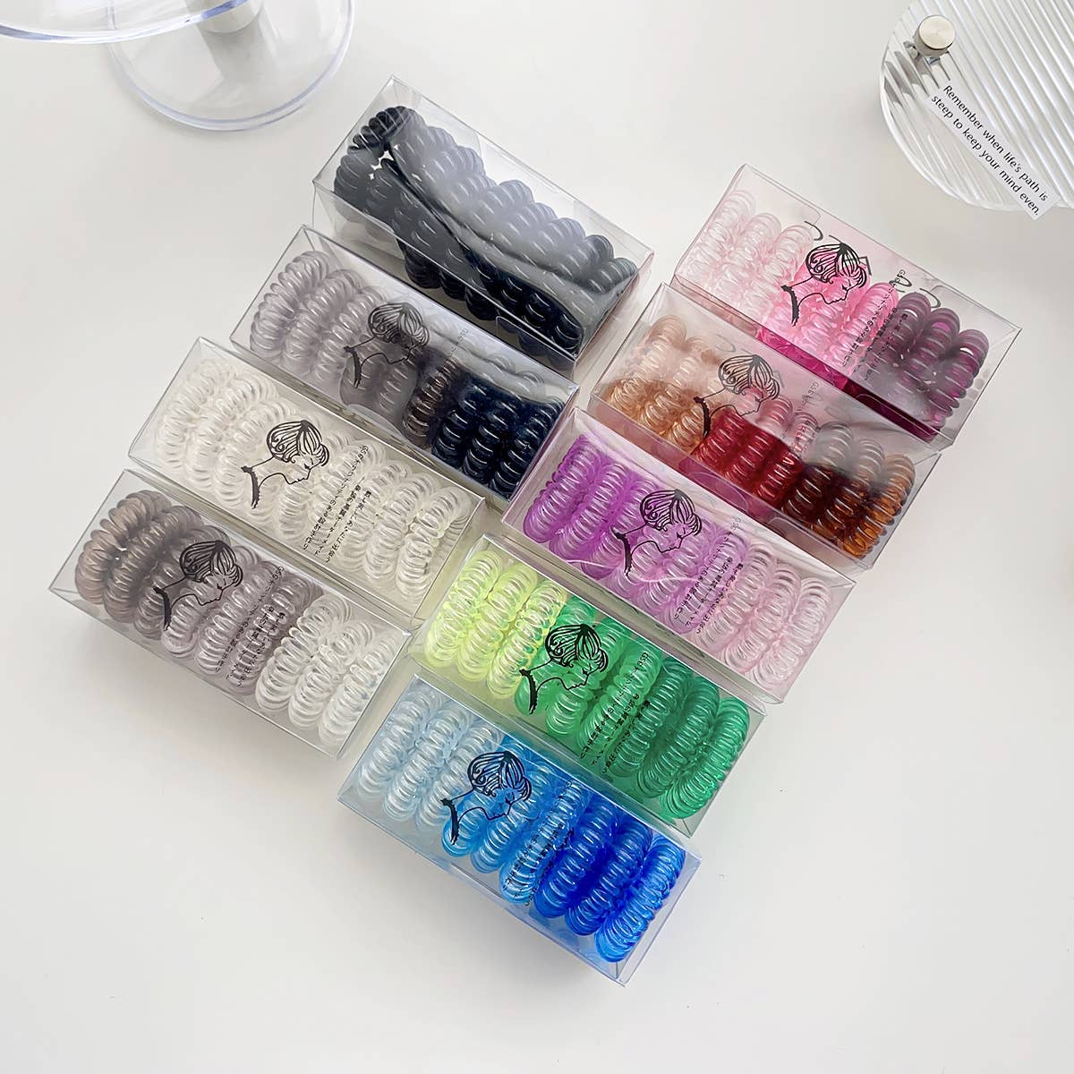 Nine candy-colored rubber bands for hair ties