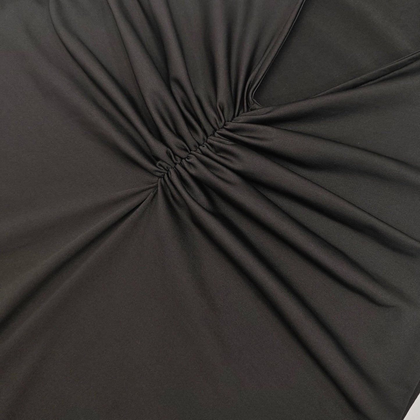 A cinched-neck backless and collared dress