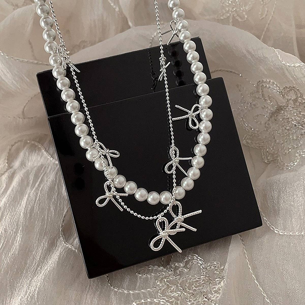 WOMEN'S TEMPERAMENT METAL BOW TASSEL NECKLACE