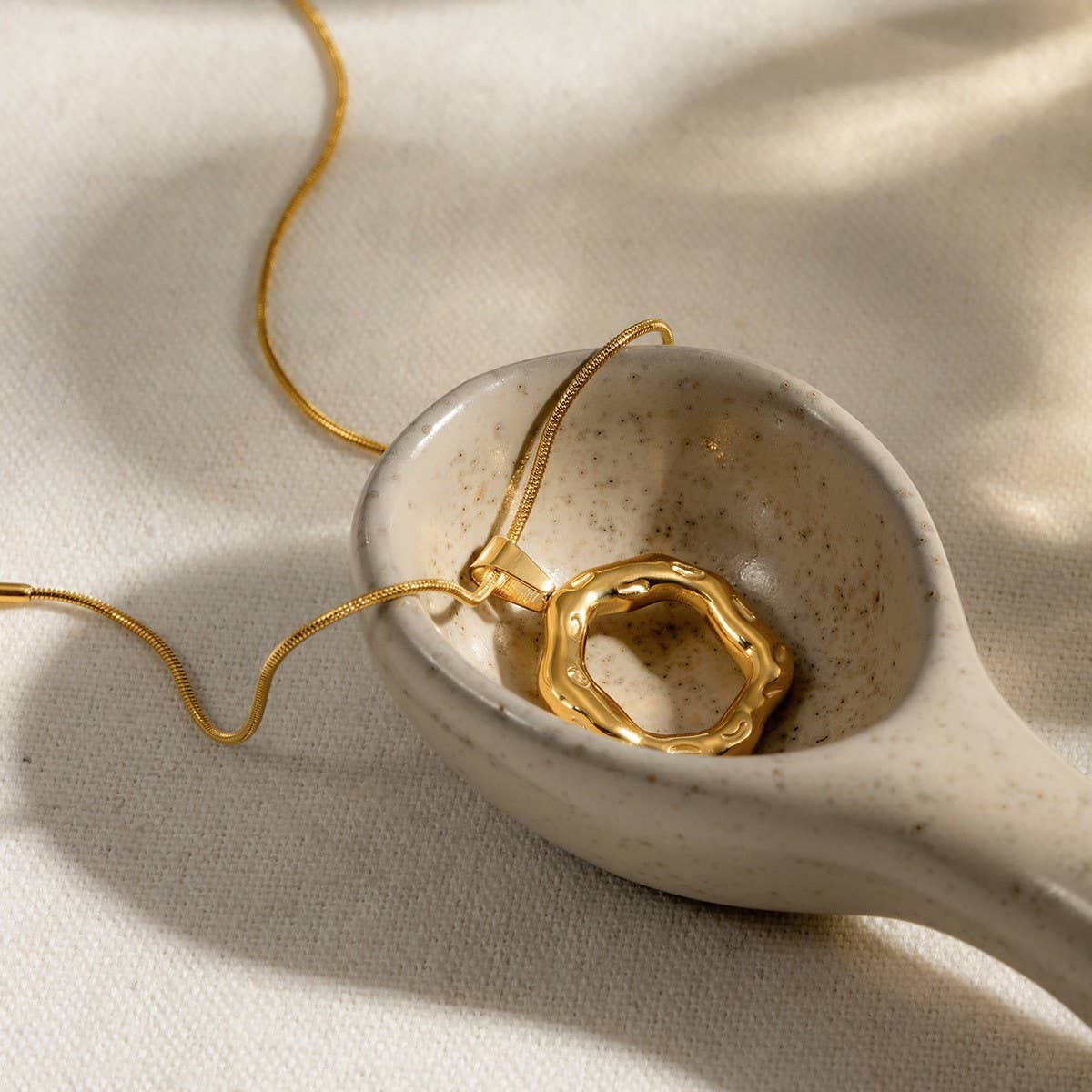 IRREGULAR HAMMERED ROUND SNAKE BONE NECKLACE