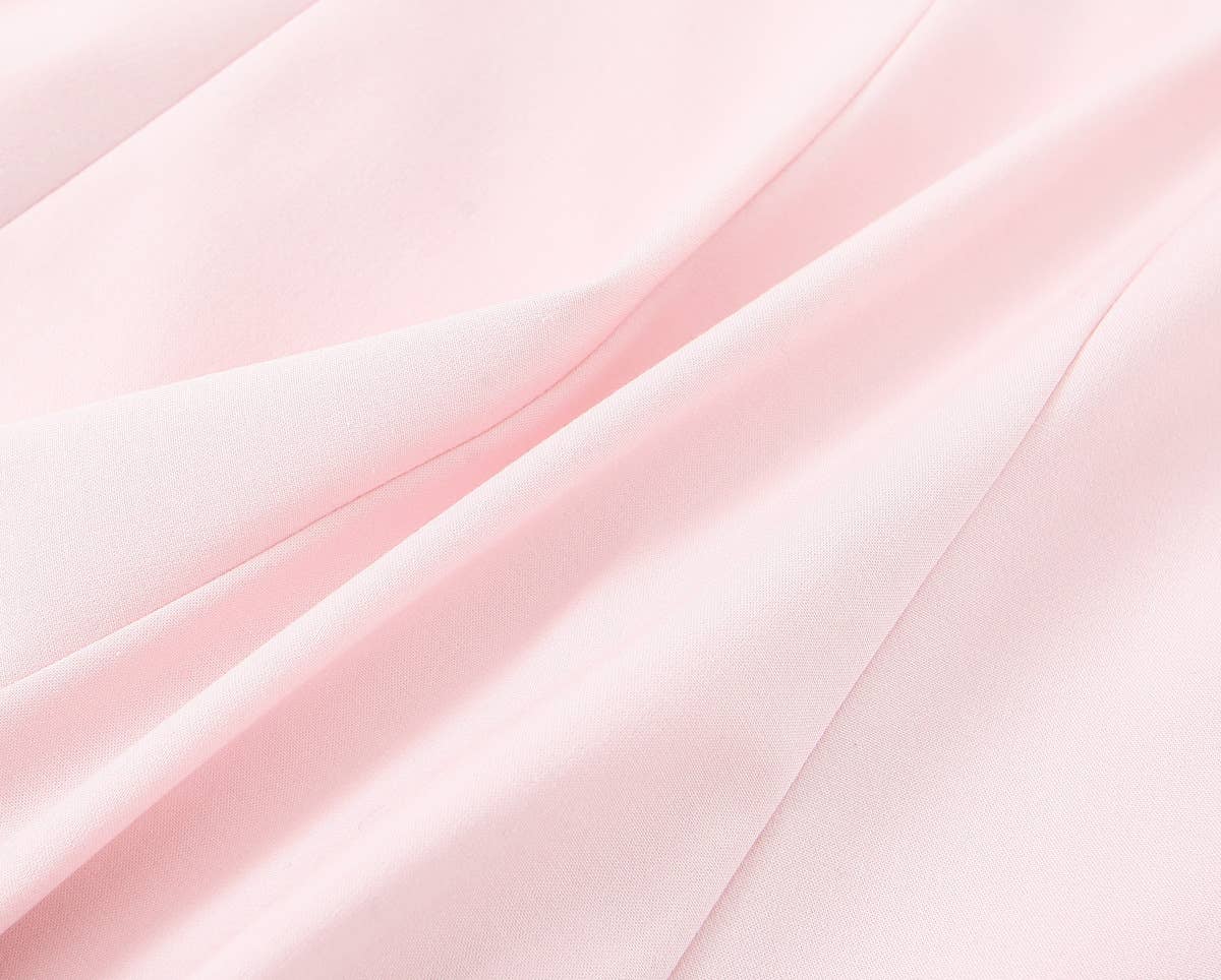 A short halter dress with striped patchwork