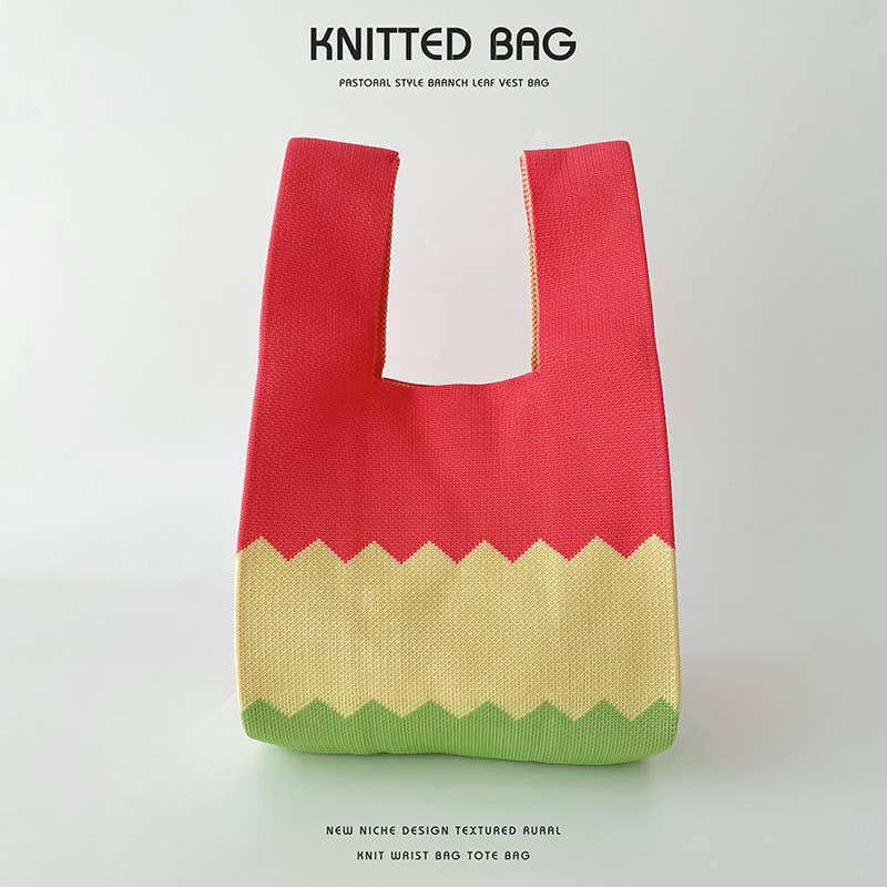 Heart-shaped color-blocked knitted handbag