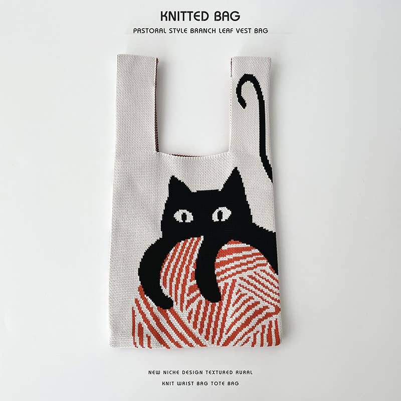 Heart-shaped color-blocked knitted handbag
