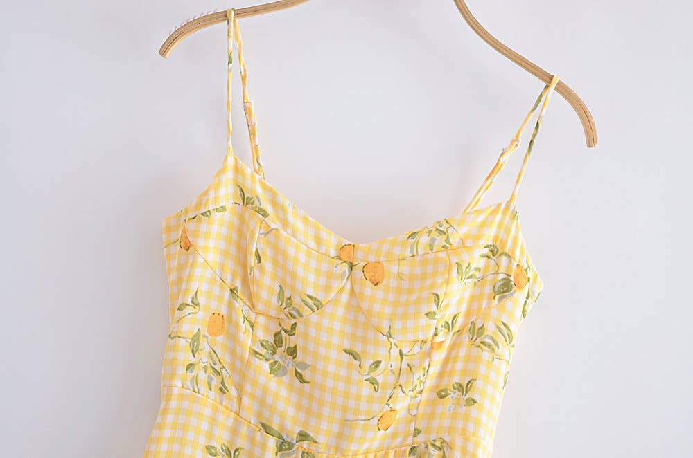 A strappy dress with floral prints and ruffles