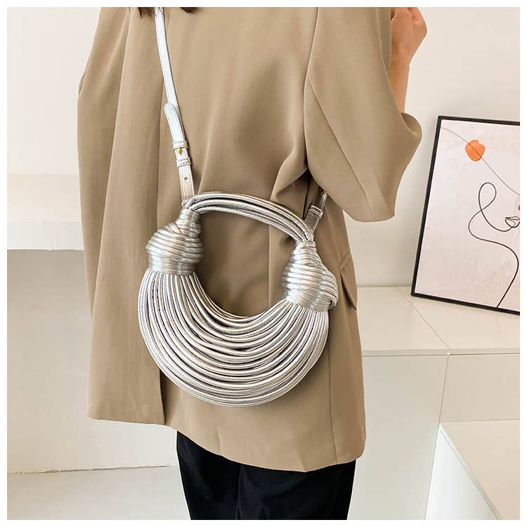 Metallic color striped appearance glossy handbag