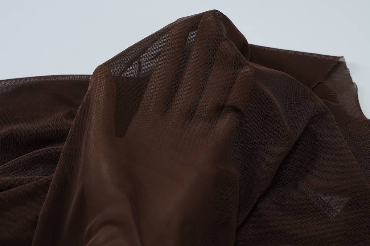 A strapless pleated patchwork gauze dress