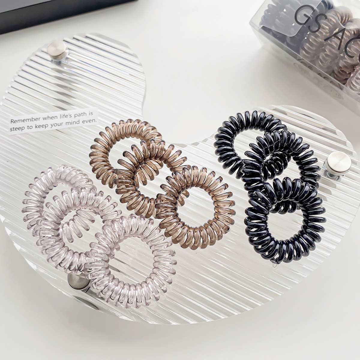 Nine candy-colored rubber bands for hair ties