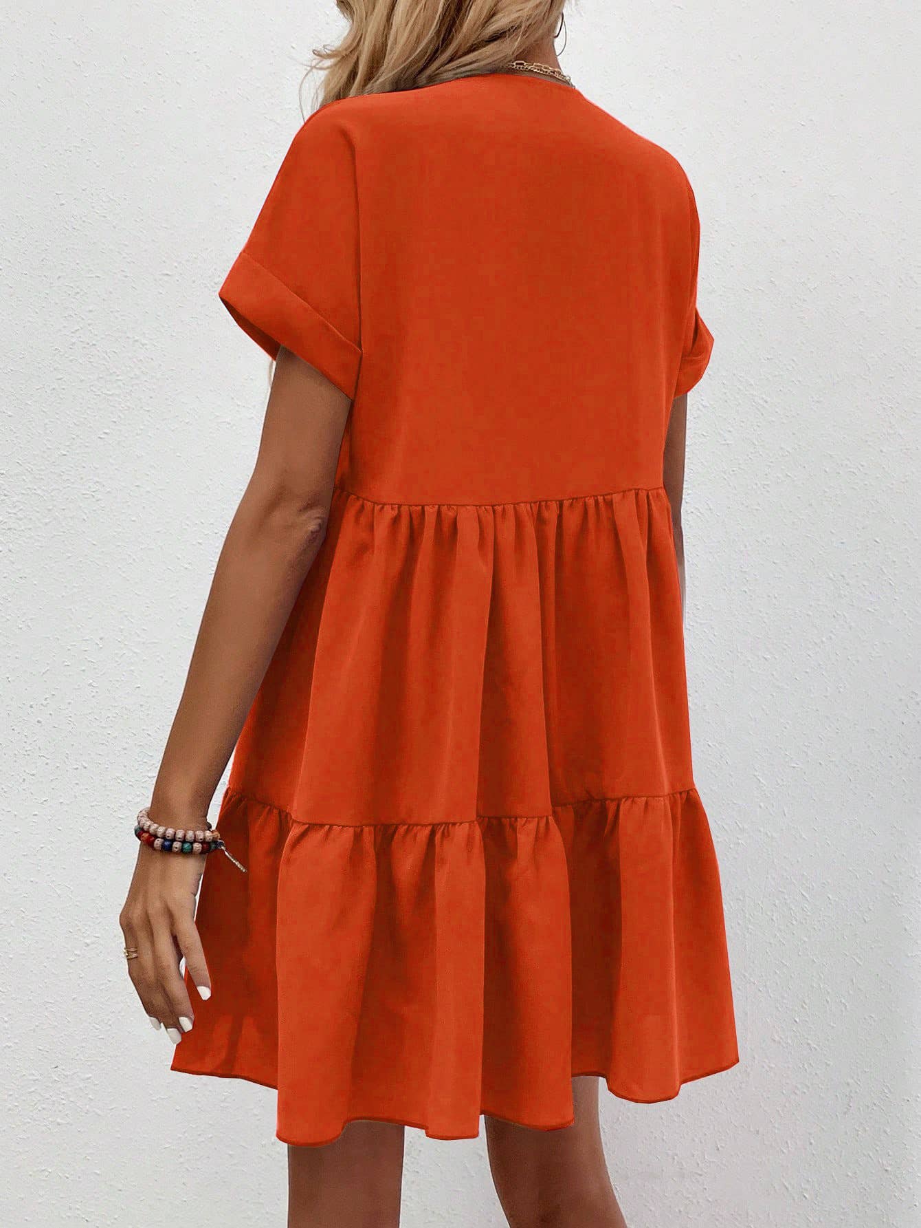 A casual, loose V-neck, large-hem short dress