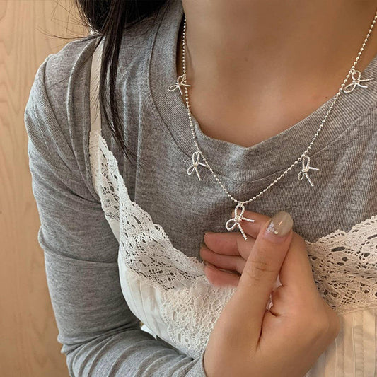 WOMEN'S TEMPERAMENT METAL BOW TASSEL NECKLACE