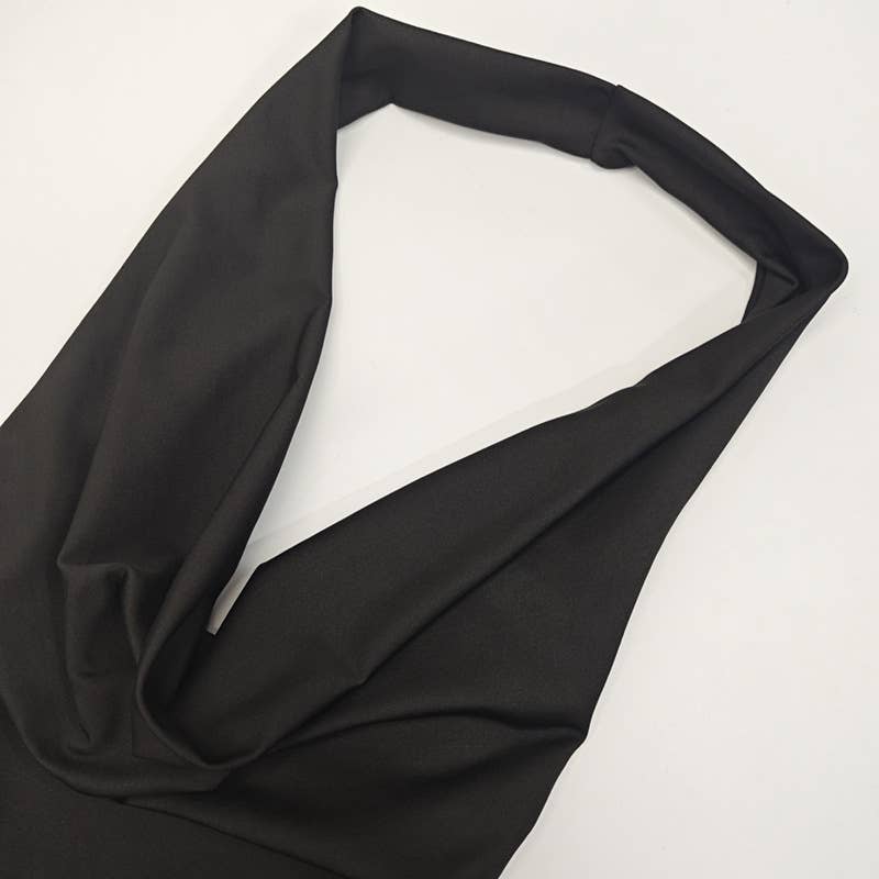 A cinched-neck backless and collared dress