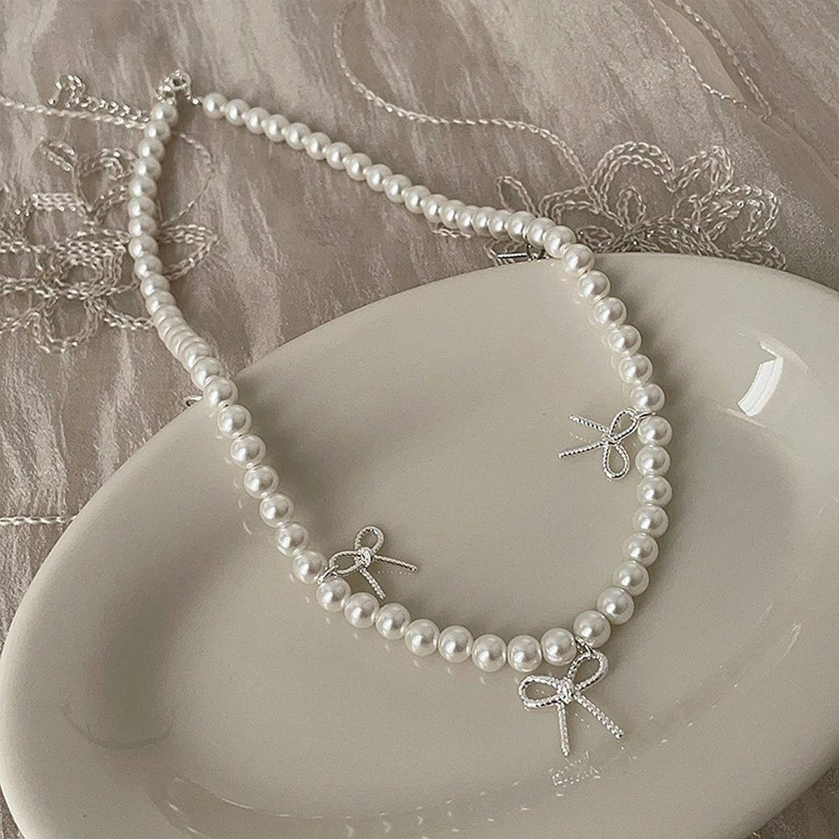 WOMEN'S TEMPERAMENT METAL BOW TASSEL NECKLACE