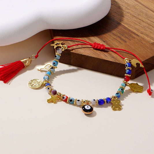 GLASS DEMON EYE METAL PENDANT TASSEL BRACELET