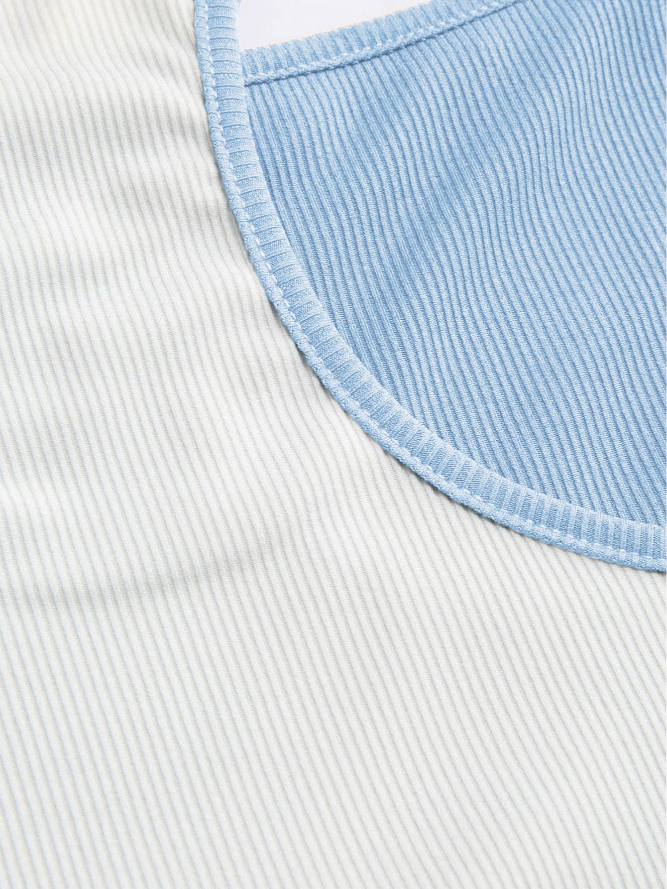 Contrasting colors and stripes form-fitting vest