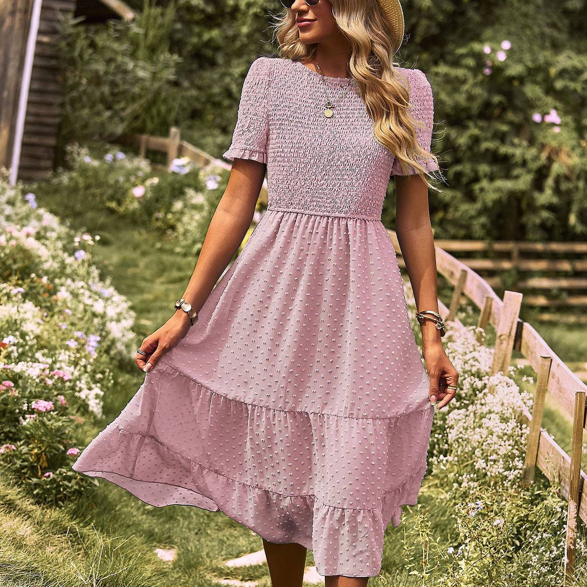 FLAUNTING A FLOWING SLIM-FIT DRESS