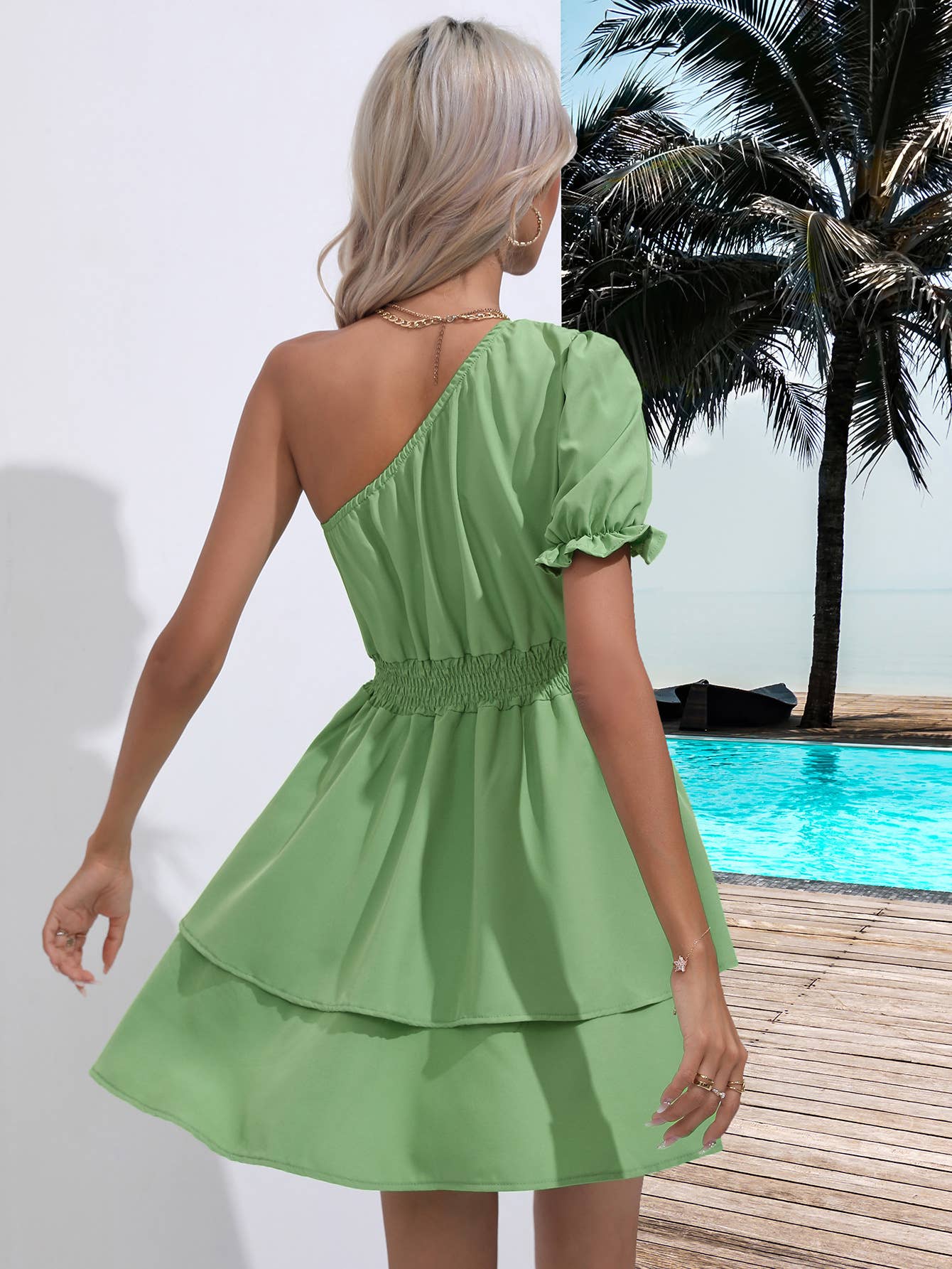 Dress with sloping shoulders and waist