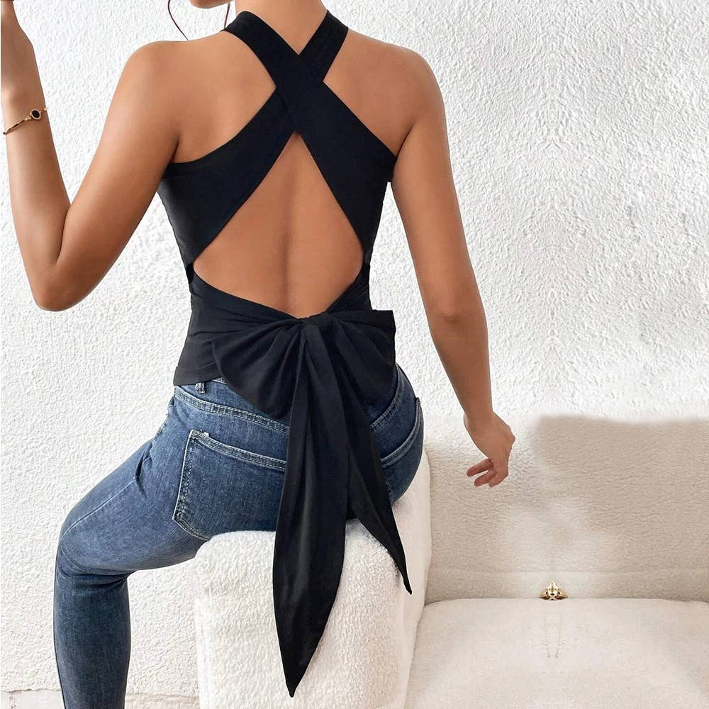 A backless, lace-up, sleeveless halter top