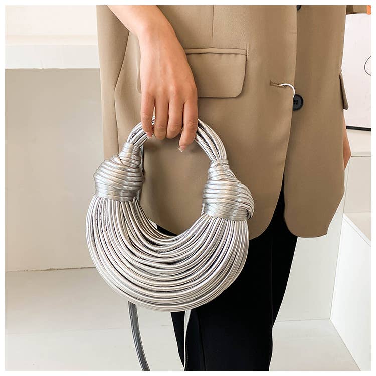 Metallic color striped appearance glossy handbag
