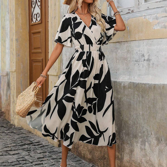 A cross-neck belt floral printed slit dress