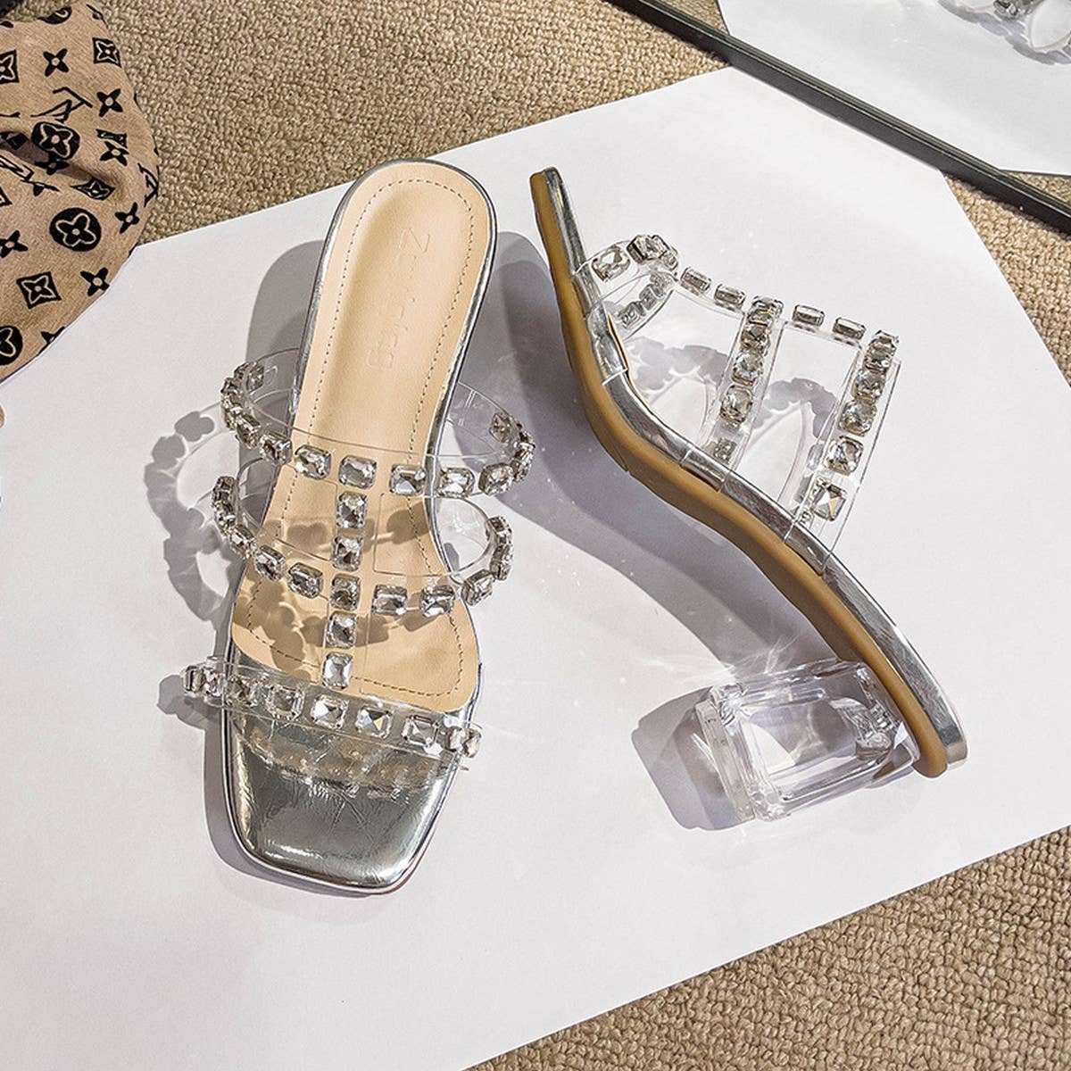 WEARING RHINESTONE STRAPPY HIGH HEELS