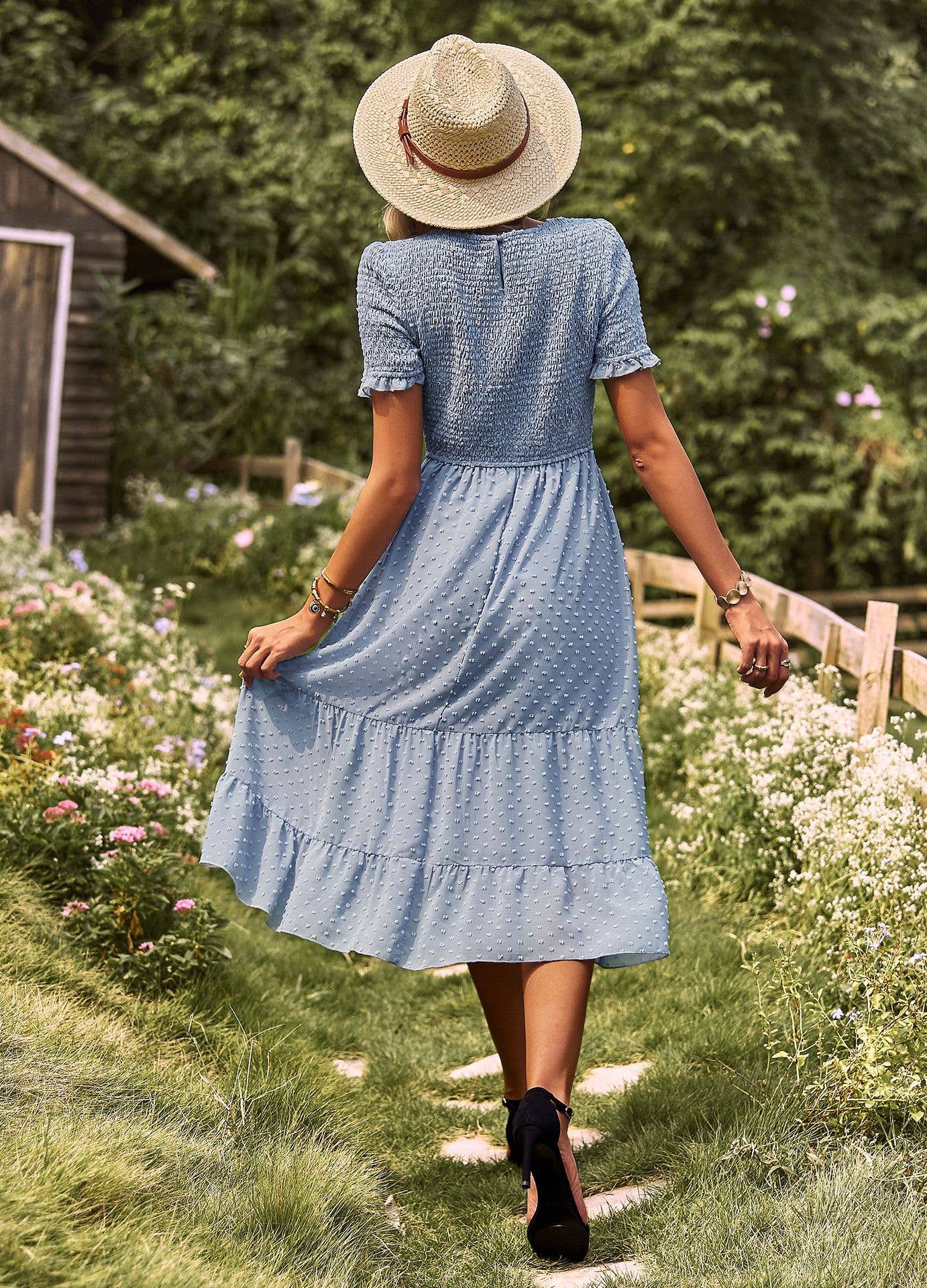 FLAUNTING A FLOWING SLIM-FIT DRESS