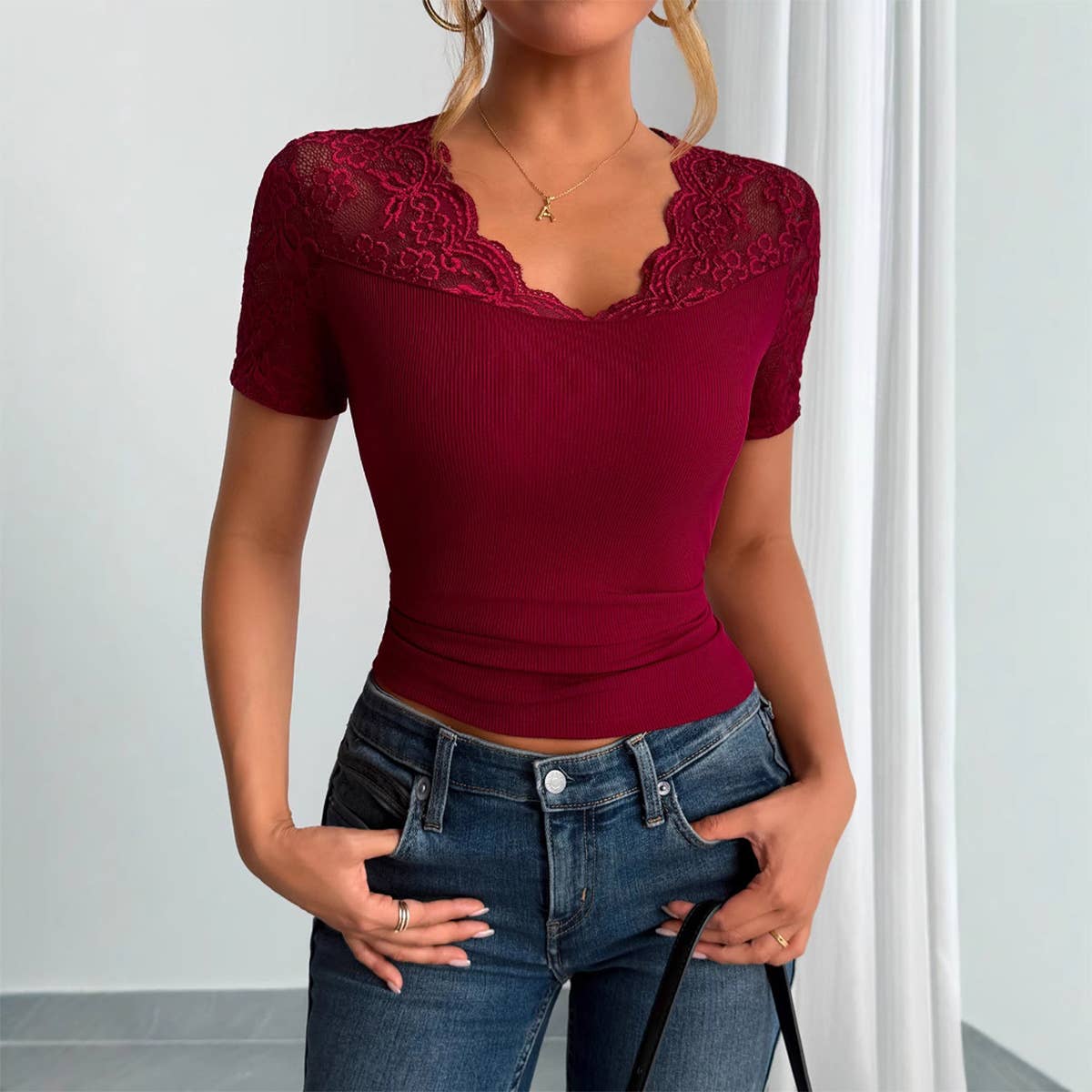 A lace-trimmed top with collared and cuffs
