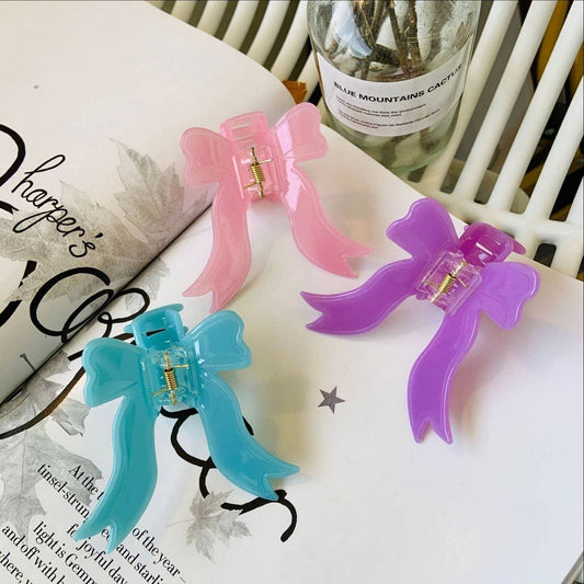 CWAHA1545_SOLID COLORED BOW STREAMERS HAIR CLAW CLIP
