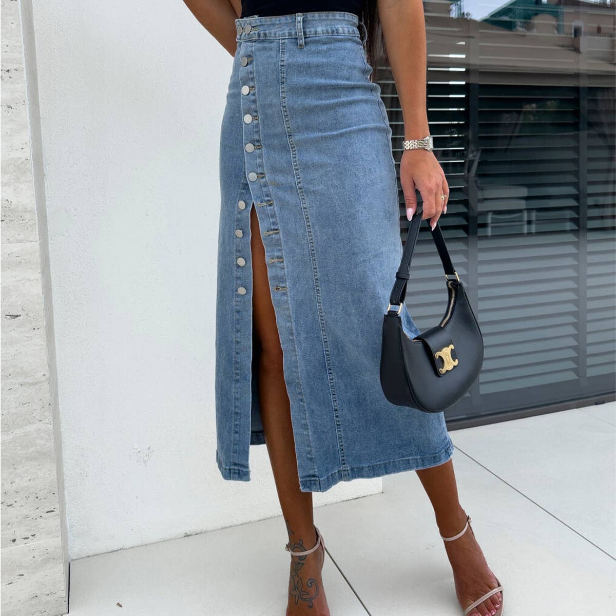 Buttoned asymmetrical high-waisted denim skirt