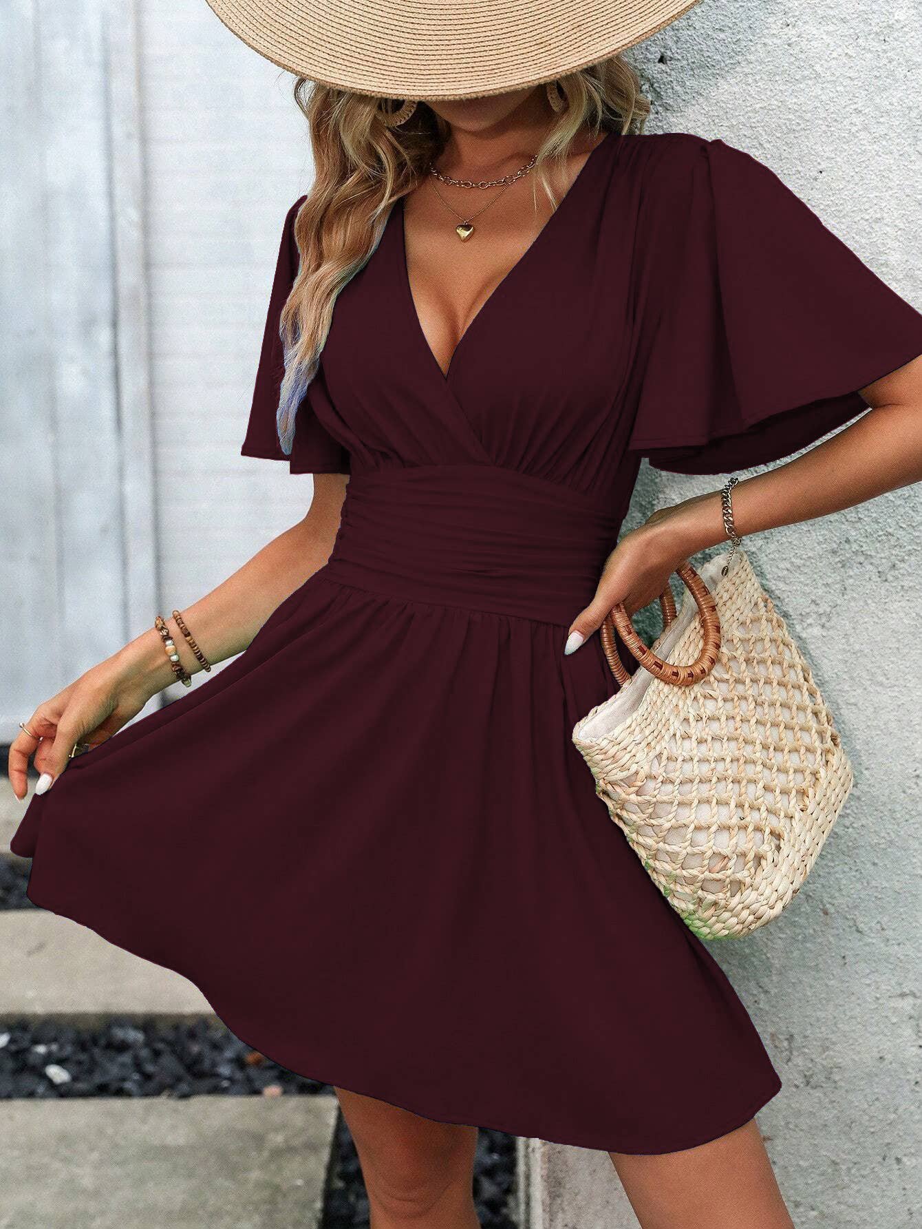A deep V-neck, lotus leaf sleeve short dress