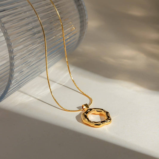 IRREGULAR HAMMERED ROUND SNAKE BONE NECKLACE