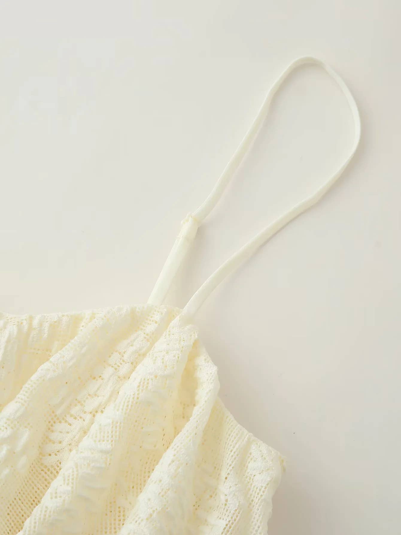 A pure color ruffled design halter top