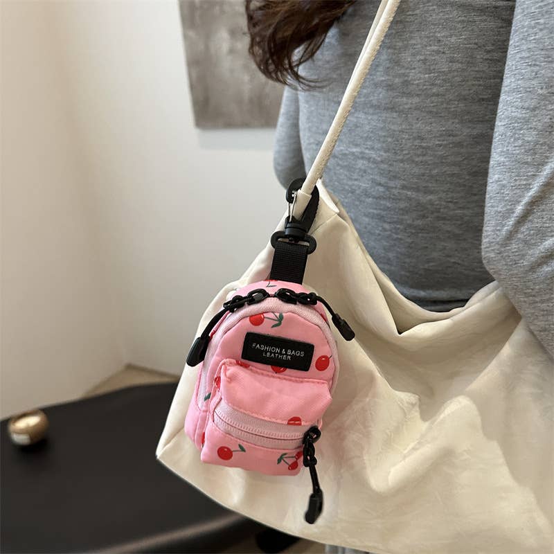 Printed mini lipstick headphones and small bag